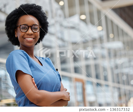 Nurse, arms crossed and portrait of black woman in hospital for medical, support and expert. Medicine, healthcare and nursing with female person in clinic for wellness, life insurance and surgery 136317332