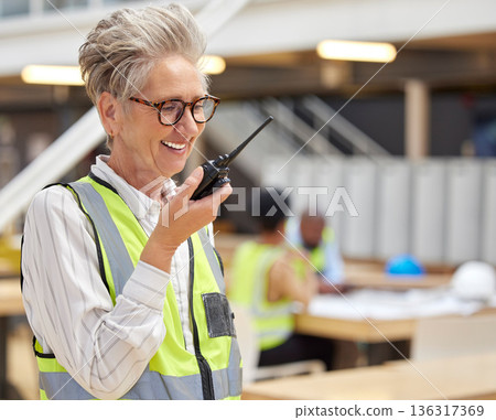 Walkie talkie, senior woman and happy architect talking for communication, construction or command. Radio, elderly engineer and manager planning industrial project management for building maintenance Walkie talkie, senior woman and happy architect talking for communication, construction or command. Radio, elderly engineer and manager planning industrial project management for building maintenance 136317369