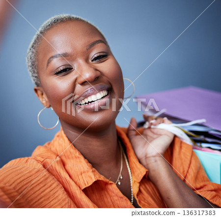 Selfie, smile and portrait of a woman with shopping bags in studio after sale, promotion or discount. Happy, excited and African female person taking picture after buying products by gray background. Selfie, smile and portrait of a woman with shopping bags in studio after sale, promotion or discount. Happy, excited and African female person taking picture after buying products by gray background. 136317383