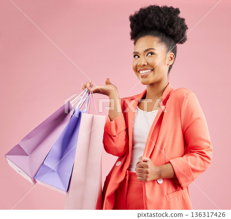 African woman, shopping bag and smile in studio, idea or thinking with sale, deal or discount by pink background. Young gen z girl, happy and gift for fashion, commerce or retail customer experience 136317426