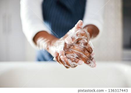 Hands, cleaning and soap with hygiene in bathroom, safety from bacteria and germs, disinfection and skincare. Health, wellness and person at home, sanitizer foam to clean and healthy with handwashing 136317443