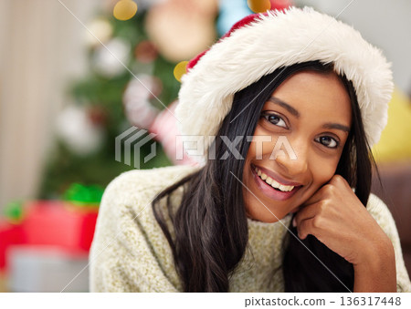 Happy woman, face and portrait with Christmas hat for festive season, celebration or gift giving time at home. Female person with smile in relax for holiday, weekend or December party at the house 136317448