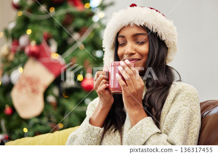 Christmas, smile or happy woman with coffee in home on holiday or vacation break with a warm beverage. Cold winter, egg nog or cozy Indian girl drinking cup of tea or hot chocolate to relax at home Christmas, smile or happy woman with coffee in home on holiday or vacation break with a warm beverage. Cold winter, egg nog or cozy Indian girl drinking cup of tea or hot chocolate to relax at home 136317455