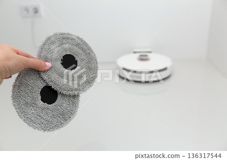 Vacuum cleaner on white glass ceramic tile floor 136317544