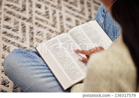 Closeup, hands and woman with a bible, spiritual and religion for peace, guidance and learning. Zoom, female person or worship with praise, reading scripture and gratitude with prayer, home and relax 136317579