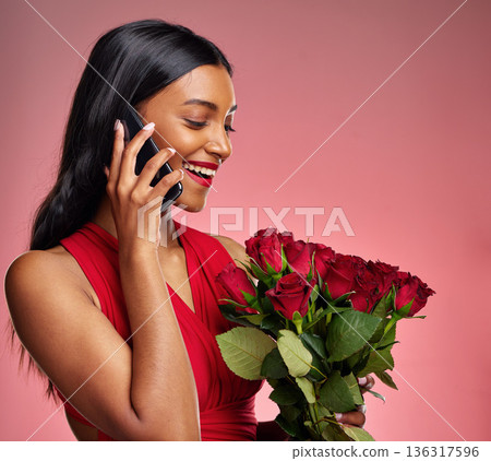 Phone call, talking and a woman with roses on a studio background for valentines day. Thank you, model and face of a young Indian girl with a flower bouquet and smartphone for romance or love on pink 136317596