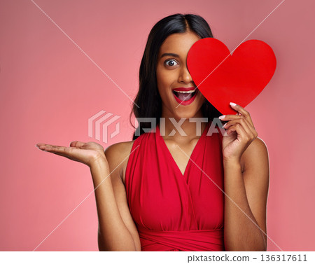 Woman, happy surprise and heart, marketing mockup in red dress and promotion of love on pink background. Valentines Day advertising, female model in portrait and wow expression for branding in studio 136317611