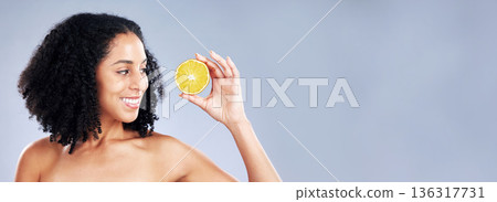 Smile, beauty and a woman with a lemon on a studio background for vitamin c and natural detox. Happy, nutrition space and a young model with fruit on a mockup banner for wellness, skincare and health Smile, beauty and a woman with a lemon on a studio background for vitamin c and natural detox. Happy, nutrition space and a young model with fruit on a mockup banner for wellness, skincare and health 136317731