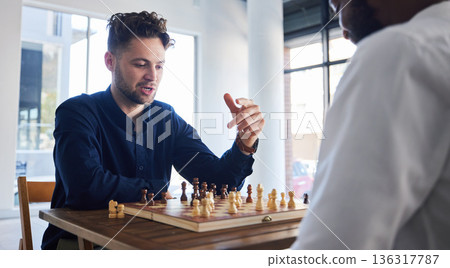 Board game, chess and men playing at a table while talking strategy or plan. Business partners or friends together to play, relax and bond with wooden icon for problem solving, challenge or checkmate 136317787