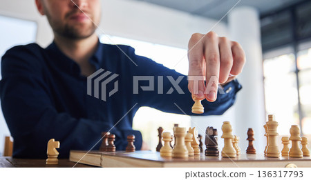 Chess, man moving a pawn and game of strategy, problem solving or person playing on chessboard in competition. Planning, choice and hand on knight or king, queen and player thinking of winning move 136317793