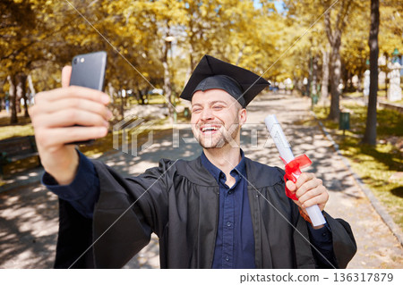 Graduation selfie, college student and man on campus, university and profile picture with diploma or certificate. Graduate success, photography and happy person in park with scholarship celebration 136317879