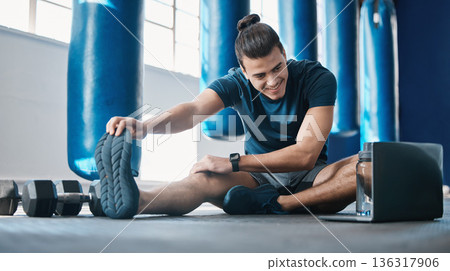 Stretching, fitness and a man with a laptop for exercise tutorial, information or a cardio video. Happy, gym and a male athlete with an online warm up on a computer before training and a workout 136317906