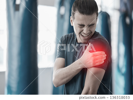 Hand, shoulder pain and the arm of a man in red highlight during a fitness workout. Healthcare, medical and emergency with a male athlete holding his joint after an accident or injury in the gym Hand, shoulder pain and the arm of a man in red highlight during a fitness workout. Healthcare, medical and emergency with a male athlete holding his joint after an accident or injury in the gym 136318033