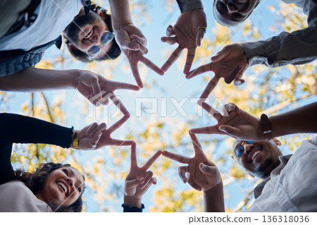 Creative people, hands and star with fingers in teamwork, solidarity or collaboration in nature. Low angle of team group touching hand together for faith, support or community, hope or startup goals 136318036