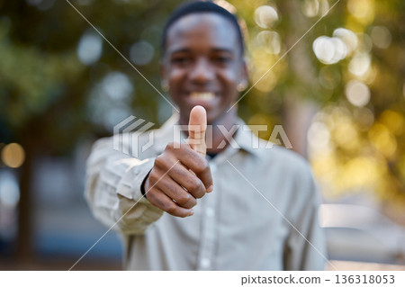 Black man, hands and thumbs up in park for good job, approval or success in the nature outdoors. Portrait of happy African male person show thumb emoji, yes sign or like for agreement or deal outside Black man, hands and thumbs up in park for good job, approval or success in the nature outdoors. Portrait of happy African male person show thumb emoji, yes sign or like for agreement or deal outside 136318053