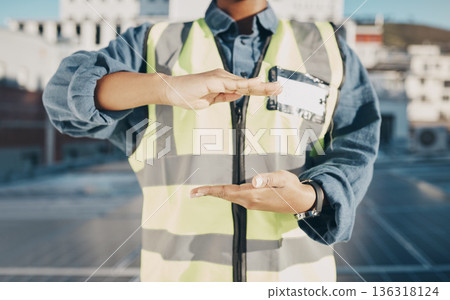 Hands, construction and engineer on a roof for solar energy, building electric plant or electricity advertising. Sustainable marketing, gesture and a worker for electrician innovation and maintenance 136318124