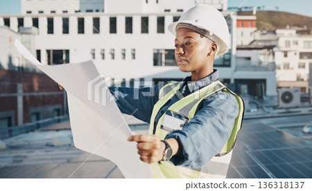 Female engineer, solar panel blueprint or outdoor on rooftop for power, sustainability plan or energy development. Black woman, photovoltaic tech or reading on roof, analysis or illustration in metro Female engineer, solar panel blueprint or outdoor on rooftop for power, sustainability plan or energy development. Black woman, photovoltaic tech or reading on roof, analysis or illustration in metro 136318137