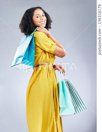 Shopping bag, fashion and young woman for happy discount, sale and retail promotion on a white background. Winning gift, giveaway and customer, model or african person in clothes portrait and studio Shopping bag, fashion and young woman for happy discount, sale and retail promotion on a white background. Winning gift, giveaway and customer, model or african person in clothes portrait and studio 136318179