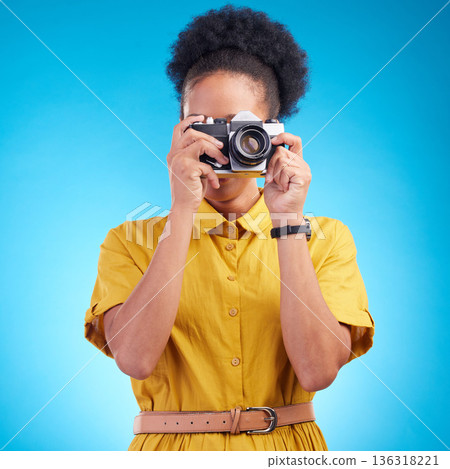 Photography, travel and black woman with camera isolated on blue background, creative artist job and talent. Art, face of photographer with hobby or career in studio taking picture for photoshoot. Photography, travel and black woman with camera isolated on blue background, creative artist job and talent. Art, face of photographer with hobby or career in studio taking picture for photoshoot. 136318221