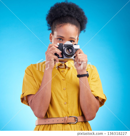 Photography, portrait and black woman with camera isolated on blue background, creative artist job talent. Art, face of happy photographer with hobby or career in studio on travel holiday photoshoot. 136318227