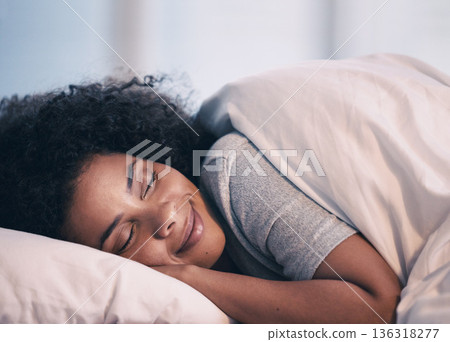 Sleeping, woman and smile in bed with morning nap at home with rest feeling calm with peace. House, bedroom and tired female person relax and comfortable on a pillow with blanket dreaming on weekend 136318277