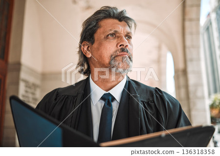 Thinking, book and a senior man judge at court, outdoor in the city during recess from a legal case or trial. Idea, authority and power with a confident magistrate in an urban town to practice law Thinking, book and a senior man judge at court, outdoor in the city during recess from a legal case or trial. Idea, authority and power with a confident magistrate in an urban town to practice law 136318358
