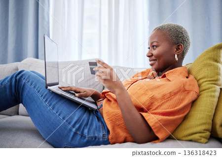 Credit card, excited or black woman with laptop for payment on ecommerce website for investment. Happy, financial or African girl customer online shopping with money on internet or fintech at home Credit card, excited or black woman with laptop for payment on ecommerce website for investment. Happy, financial or African girl customer online shopping with money on internet or fintech at home 136318423