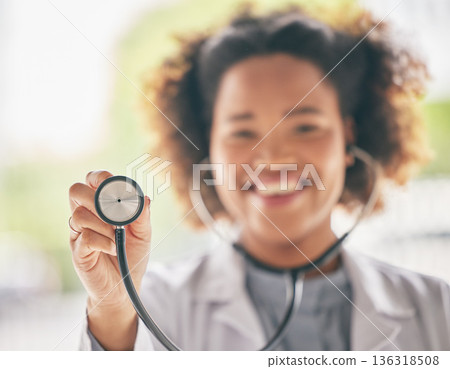 Healthcare, stethoscope and cardiology with a doctor in the hospital for a routine checkup during an appointment. Medical, hand and heart health with a woman medicine professional in a clinic Healthcare, stethoscope and cardiology with a doctor in the hospital for a routine checkup during an appointment. Medical, hand and heart health with a woman medicine professional in a clinic 136318508