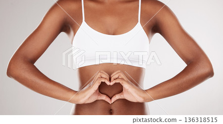 Body, heart and stomach of a woman for health and wellness on a white studio background. Fitness, gut and diet of aesthetic female model for weight loss, balance or digestion with hands or love emoji Body, heart and stomach of a woman for health and wellness on a white studio background. Fitness, gut and diet of aesthetic female model for weight loss, balance or digestion with hands or love emoji 136318515