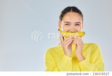 Happy, banana and portrait of woman with fruit in studio for healthy eating, wellness and diet. Food, lose weight and mockup person on white background with fruits for nutrition, detox and digestion 136318527