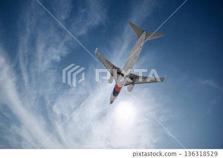 A huge passenger plane is landing in airport of Phuket, Thailand, a bottom view  136318529