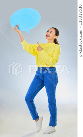Speech bubble, woman pointing and student presentation, chat or communication for college opportunity or forum. Portrait, information and person for university FAQ or quote on studio white background 136318530