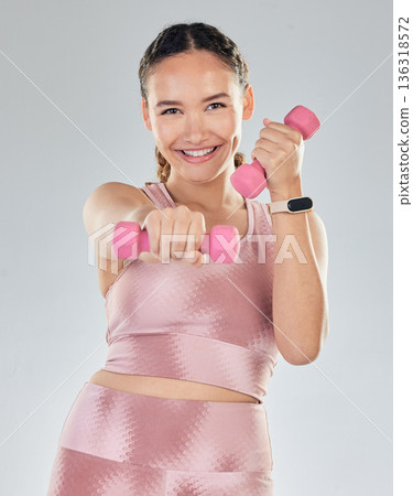 Fitness, portrait and woman with dumbbell isolated on studio white background for health, exercise and gym power. Bodybuilder, face and sports person happy for workout goals and lose weight training 136318572