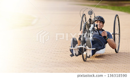 Man with disability, handbike and outdoor bicycle for sports, race or exercise power with flare of mockup space. Fitness, male athlete with paraplegia and cycling in competition, challenge or contest Man with disability, handbike and outdoor bicycle for sports, race or exercise power with flare of mockup space. Fitness, male athlete with paraplegia and cycling in competition, challenge or contest 136318590