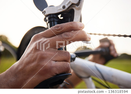 Hands, cycling and brakes on a bicycle for a person with a disability to exercise, cycle and fitness training in the park. Braking, hand on pedal or handlebars to stop, slow or control speed on bike Hands, cycling and brakes on a bicycle for a person with a disability to exercise, cycle and fitness training in the park. Braking, hand on pedal or handlebars to stop, slow or control speed on bike 136318594