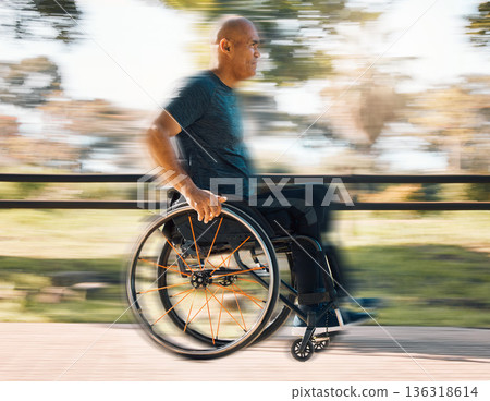 Man with a disability, wheelchair and motion of exercise in the park, nature or athlete in outdoor fitness training. Blurred background, sport and disabled person exercising or speed on wheels 136318614