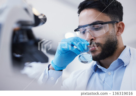 Man, smell or scientist with liquid to research for a test analysis, experiment or medical innovation. Beaker, studying biotechnology or researcher sniffing in laboratory for science development 136319016