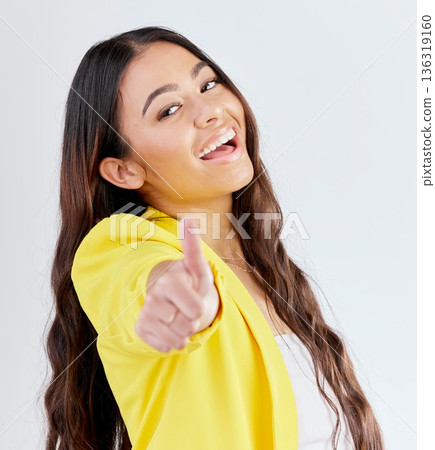 Portrait, support and woman with thumbs up, achievement and like symbol against a white studio background. Winning, female person or model with hand gesture, sign or positive with review or agreement 136319160