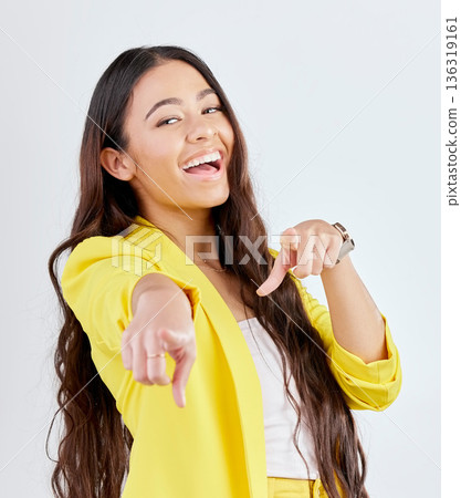 Portrait, pointing and decision with an excited woman in studio on a gray background to select you. Smile, hands and choice with a happy young female model in yellow clothes to vote on an option Portrait, pointing and decision with an excited woman in studio on a gray background to select you. Smile, hands and choice with a happy young female model in yellow clothes to vote on an option 136319161
