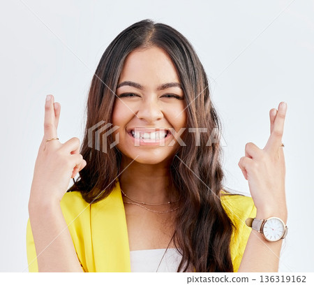 Hope, fingers crossed and portrait of woman in studio with hand gesture for winning, good luck and wish. Winner, white background and excited female person for competition, promotion and lottery Hope, fingers crossed and portrait of woman in studio with hand gesture for winning, good luck and wish. Winner, white background and excited female person for competition, promotion and lottery 136319162