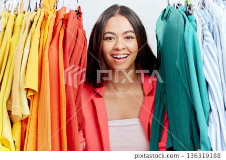 Fashion, choice and clothes with portrait of woman in studio for decision, shopping and wardrobe. Boutique, retail and store with face of customer on white background for search, creative and sale 136319188