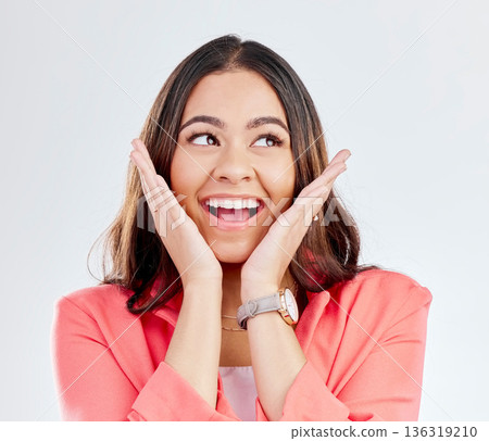 Woman, excited and hands on face in studio for announcement, promotion or sale. Headshot of a happy woman on a studio background for wow surprise, discount or facial expression for gossip or secret Woman, excited and hands on face in studio for announcement, promotion or sale. Headshot of a happy woman on a studio background for wow surprise, discount or facial expression for gossip or secret 136319210