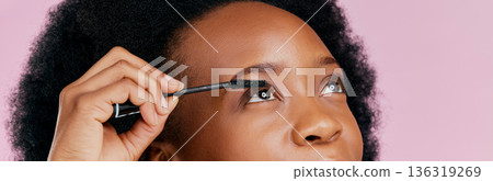 Eyes, mascara and brush, makeup and black woman, beauty and cosmetic product on pink background. Female model, hand and eyelash extension, cosmetology and lashes transformation with glow in studio Eyes, mascara and brush, makeup and black woman, beauty and cosmetic product on pink background. Female model, hand and eyelash extension, cosmetology and lashes transformation with glow in studio 136319269