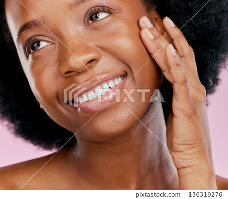 Black woman with smile, natural beauty and skincare with cosmetics and hand touching face on pink background. African female model, glow and skin, happy and dermatology with facial in studio 136319276