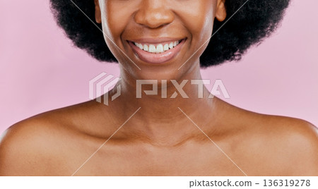 Closeup, natural or black woman with a smile, mouth or wellness with oral care or skincare on a studio background. Zoom, female person or model with cosmetics, lip gloss and beauty with glow or shine 136319278