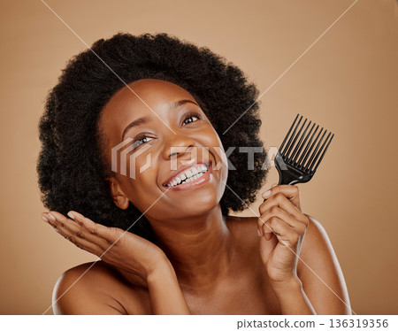 Hair, comb and an excited model black woman in studio on a brown background for beauty or cosmetics. Aesthetic, afro and haircare with a happy young female person thinking about natural cosmetics Hair, comb and an excited model black woman in studio on a brown background for beauty or cosmetics. Aesthetic, afro and haircare with a happy young female person thinking about natural cosmetics 136319356