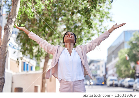 Freedom, city and businesswoman stretching arms in achievement of success, happiness and motivation. Urban business, power and happy woman in street in winning celebration of promotion, bonus or deal Freedom, city and businesswoman stretching arms in achievement of success, happiness and motivation. Urban business, power and happy woman in street in winning celebration of promotion, bonus or deal 136319369