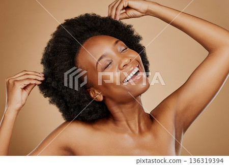 Hair care, beauty and black woman with luxury, smile and wellness against a brown studio background. Female person, model and girl with happiness, dermatology and cosmetics with grooming and shampoo Hair care, beauty and black woman with luxury, smile and wellness against a brown studio background. Female person, model and girl with happiness, dermatology and cosmetics with grooming and shampoo 136319394