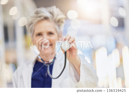 Portrait, health and stethoscope with an old woman doctor in the hospital for cardiology or treatment. Medical, heart care and wellness with a senior female medicine professional in a clinic Portrait, health and stethoscope with an old woman doctor in the hospital for cardiology or treatment. Medical, heart care and wellness with a senior female medicine professional in a clinic 136319425