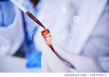 Hands, pipette and scientist with blood test tube for research in laboratory. Science, medical professional and doctor with dropper for dna analysis, liquid and biology experiment to study dna sample 136319471
